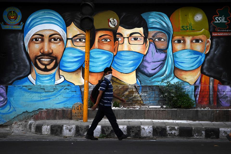 A mural salutes health workers in New Delhi. On July 14, the government eased a nationwide lockdown imposed as a preventive measure against  COVID-19.