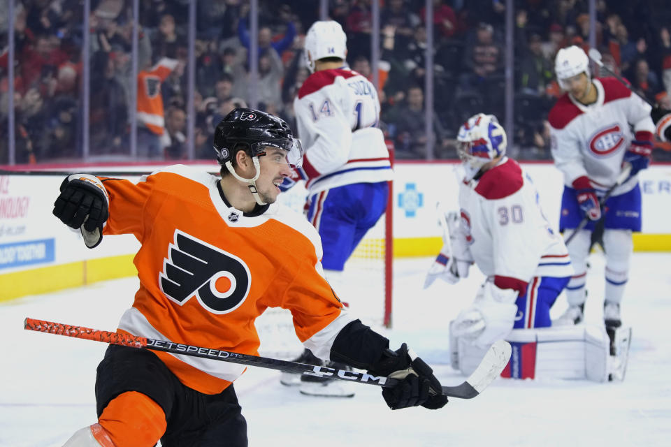 Philadelphia Flyers' Morgan Frost, left, reacts after scoring a goal during the second period of an NHL hockey game against the Montreal Canadiens, Tuesday, March 28, 2023, in Philadelphia. (AP Photo/Matt Slocum)
