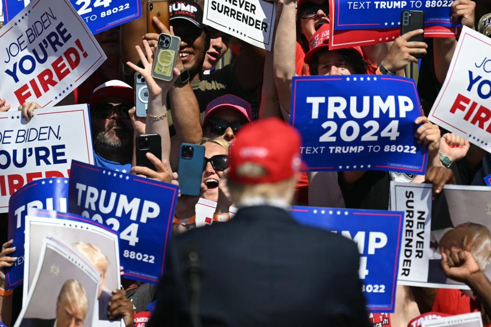 Supporters cheer as Former US President and Republican presidential candidate Donald Trump arrives to speak during a campaign rally at the Historic Greenbrier Farms in Chesapeake, Virginia, on July 28, 2024. (Photo by Jim WATSON / AFP) (Photo by JIM WATSON/AFP via Getty Images)