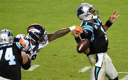 Feb 7, 2016; Santa Clara, CA, USA; Carolina Panthers quarterback Cam Newton (1) has his pass knocked down by Denver Broncos outside linebacker Von Miller (58) during the fourth quarter in Super Bowl 50 at Levi's Stadium. Mandatory Credit: Richard Mackson-USA TODAY Sports