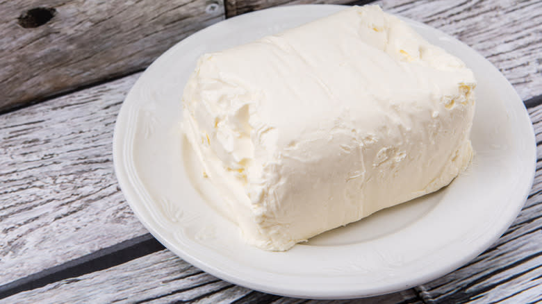 Block of cream cheese on a plate