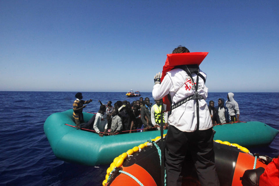 African migrants on a rubber boat in the Mediterranean Sea, off Libya are rescued by the MV Geo Barents vessel of MSF (Doctors Without Borders), in the central Mediterranean route, Monday, Sept. 20, 2021. (AP Photo/Ahmed Hatem)