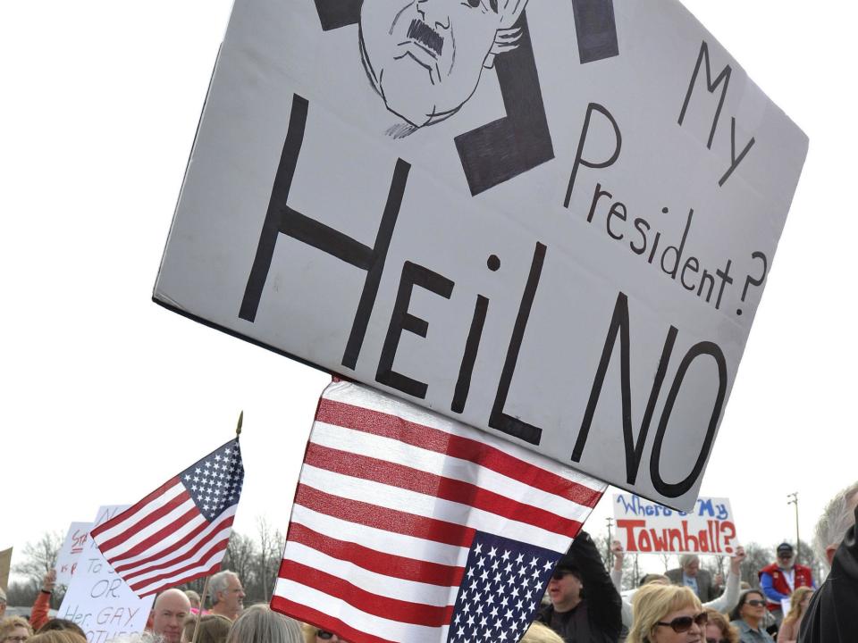 Protest outside a Mitch McConnell town hall in Kentucky this week: AP