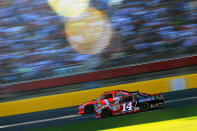 Tony Stewart, driver of the #14 Office Depot/Mobil 1 Chevrolet, and Jamie McMurray, driver of the #1 Bass Pro Shops/Arctic Cat Chevrolet, race through the tri-oval during the NASCAR Sprint Cup Series Coca-Cola 600 at Charlotte Motor Speedway on May 27, 2012 in Concord, North Carolina. (Photo by Jared C. Tilton/Getty Images for NASCAR)