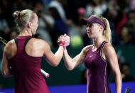 Tennis - WTA Tour Finals - Singapore Indoor Stadium, Kallang, Singapore - October 27, 2018 Netherlands' Kiki Bertens shakes hands with Ukraine's Elina Svitolina after their semi final match REUTERS/Edgar Su