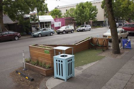 A public "parklet" that features strawberry plants and a small seating area is pictured in Seattle, Washington June 2, 2015. REUTERS/David Ryder
