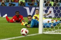 <p>Danny Rose, Mateus Uribe, and goalkeeper David Ospina all watch as the Englishman’s shot rolls just wide of the post </p>