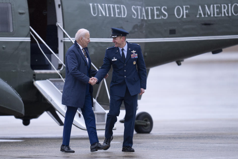 President Joe Biden shakes hands with Col. Gregory Adams, 89th Operations Group Commander, before boarding Air Force One at Andrews Air Force Base, Md., Tuesday, Jan. 31, 2023, en route to New York. (AP Photo/Jess Rapfogel)