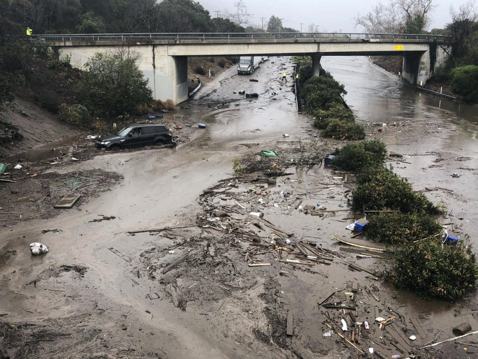 <p>U.S. Highway 101 at the Olive Mill Road overpass is flooded with runoff water from Montecito Creek in Montecito, Calif. on Tuesday, Jan. 9, 2018. (Photo: Mike Eliason/Santa Barbara County Fire Department via AP) </p>