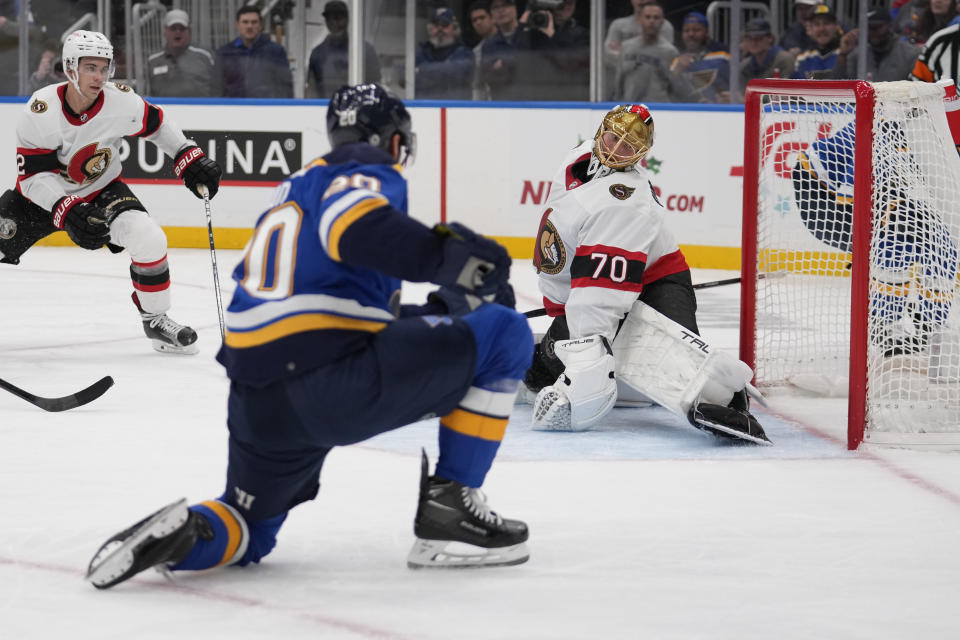 St. Louis Blues' Brandon Saad scores past Ottawa Senators goaltender Joonas Korpisalo (70) during the second period of an NHL hockey game Thursday, Dec. 14, 2023, in St. Louis. (AP Photo/Jeff Roberson)