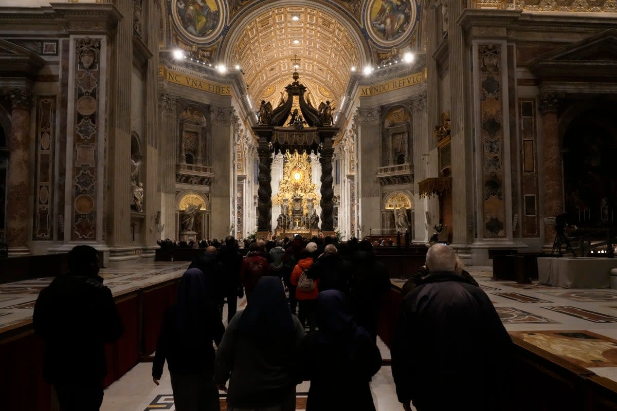 Catholics queue in St Peter’s Basilica on Wednesday to pay their respects (AP)