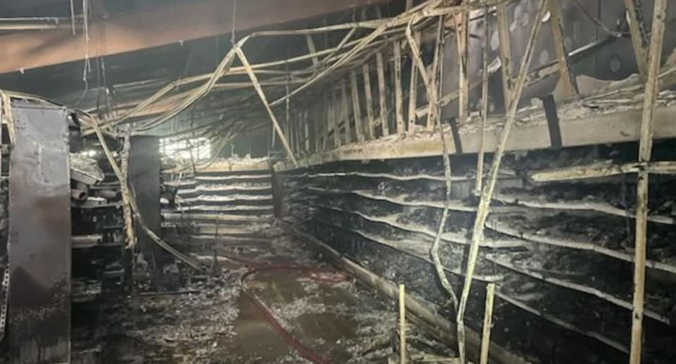 The Woolworths fire completely destroyed the store with blackened shelves and burnt interiors. 