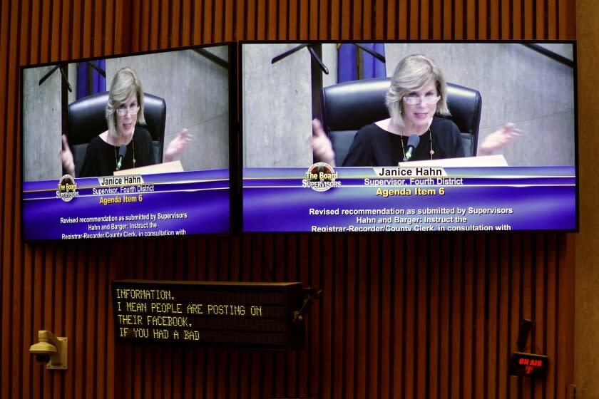 LOS ANGELES, CA. - MARCH 10, 2020: A monitor displaying Supervisor Janice Hahn speaking time Los Angeles County Elections chief Dean Logan as he testifies before the Los Angeles County Board of Supervisors during a meeting at the Los Angeles County Hall of Administration on Tues., March 10, 2020 in Los Angeles, CA. (Kent Nishimura / Los Angeles Times)