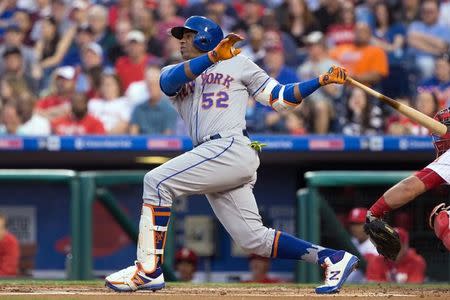 Apr 11, 2017; Philadelphia, PA, USA; New York Mets left fielder Yoenis Cespedes (52) hits a three RBI home run against the Philadelphia Phillies during the first inning at Citizens Bank Park. Mandatory Credit: Bill Streicher-USA TODAY Sports