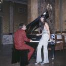 <p>Wearing sparkling metallic pants and a matching sequin top for a performance in Italy with Sonny Bono. </p>