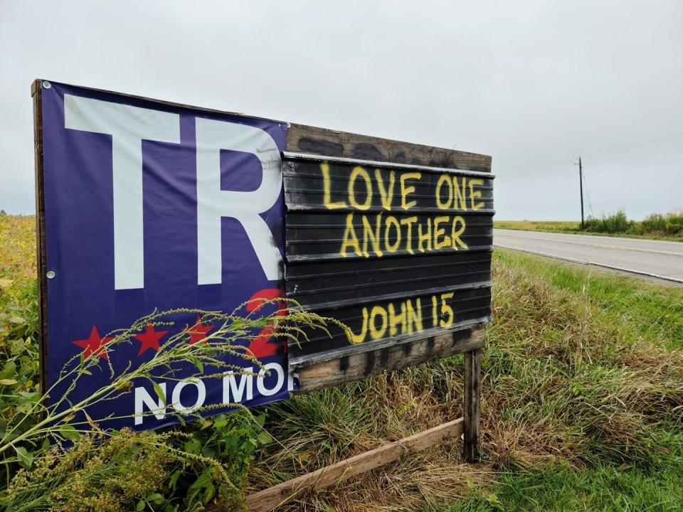 A large political sign near Attica in central Iowa has been through at least four iterations because of vandalism and updates.