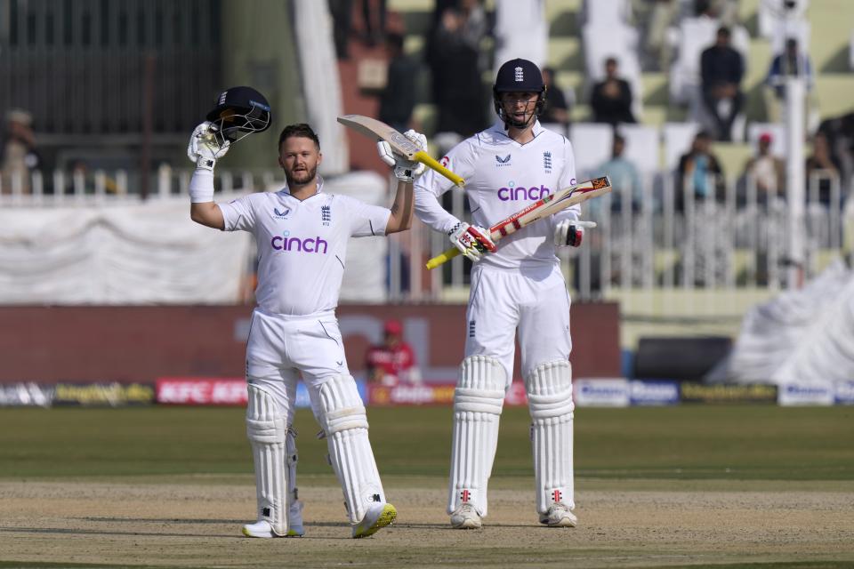England's Ben Duckett, left, celebrates after scoring century during the first day of the first test cricket match between Pakistan and England, in Rawalpindi, Pakistan, Dec. 1, 2022. (AP Photo/Anjum Naveed)