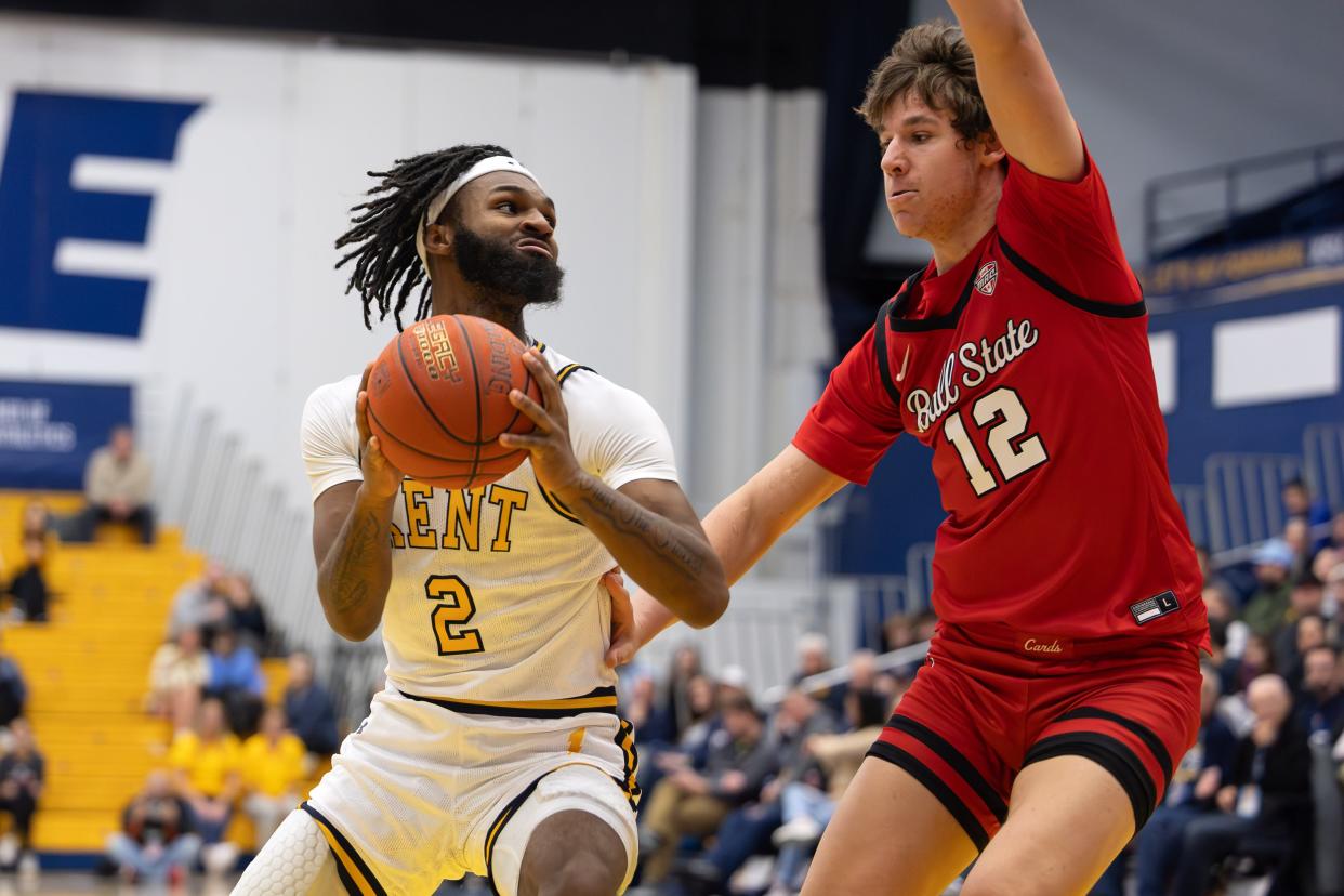 Kent State guard Reggie Bass drives to the basket past Ball State guard Jurica Zagorsak during the first half Tuesday in Kent. Bass finished with 11 points in the Golden Flashes' 82-69 win.