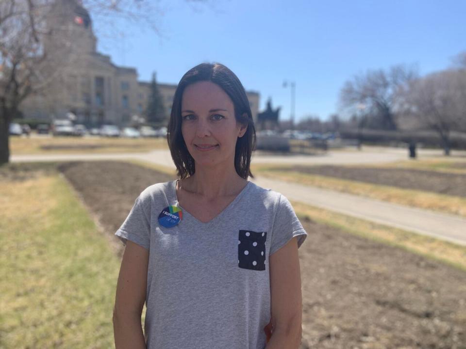 Stephanie Vance of Regina stands in front of empty flower beds at Queen Elizabeth II Gardens. She has been visiting the garden since she was a little girl, and takes her children there nearly every day in the summer. 