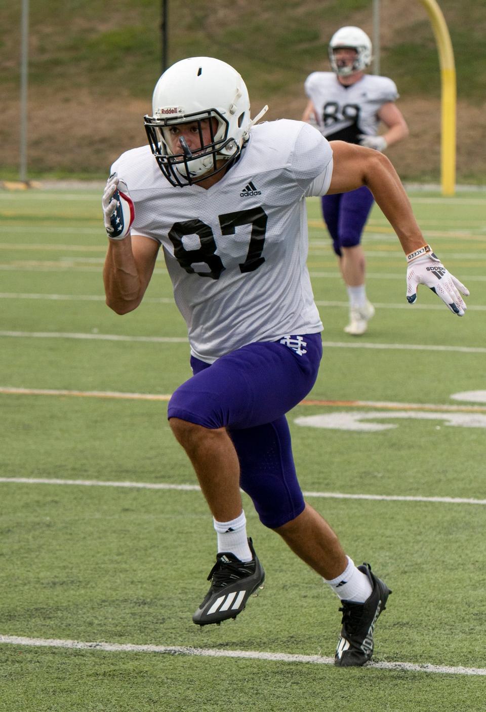 Former St. Johns and Loomis Chaffee star Matt Brunelle runs sprints Holy Cross football practice on Thursday.