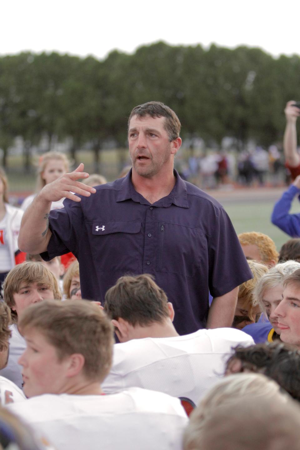 Jim Ned head coach Matt Fanning speaks with both teams after Brock's 70-25 win in the 3A Division I regional semifinals.