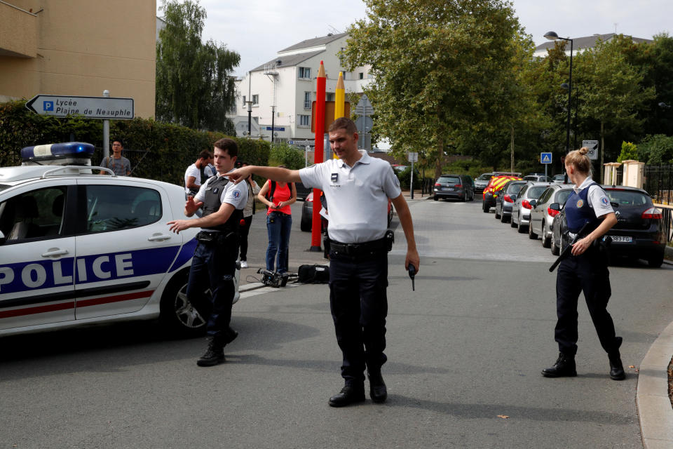  French police secure a street after a man killed two persons and injured an other in a knife attack in Trappes. (Reuters)