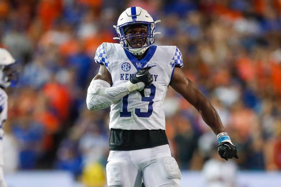 Kentucky linebacker J.J. Weaver celebrates after making a tackle during last season’s win at Ben Hill Griffin Stadium in Gainesville.