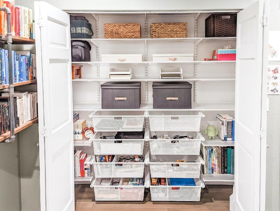 The Elfa system with drawers from The Container Store vastly improved storage in this spare bedroom closet done by Pieces Into Place.