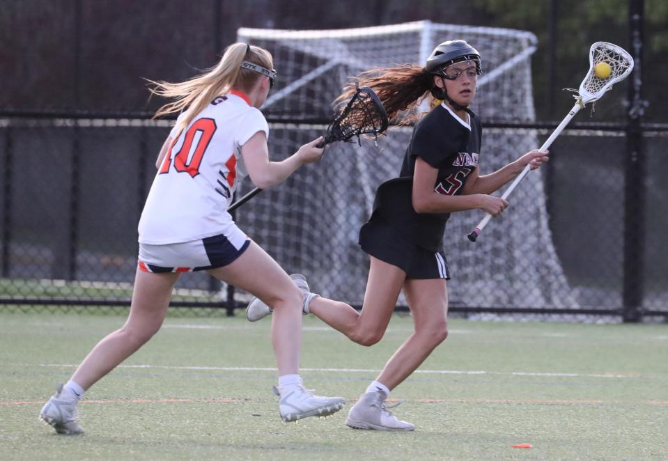 Nyack's Kate Gould is pressured by Horace Greeley's Erica Rosendorf during their game at Horace Greeley April 25, 2023. Nyack won 16-6.