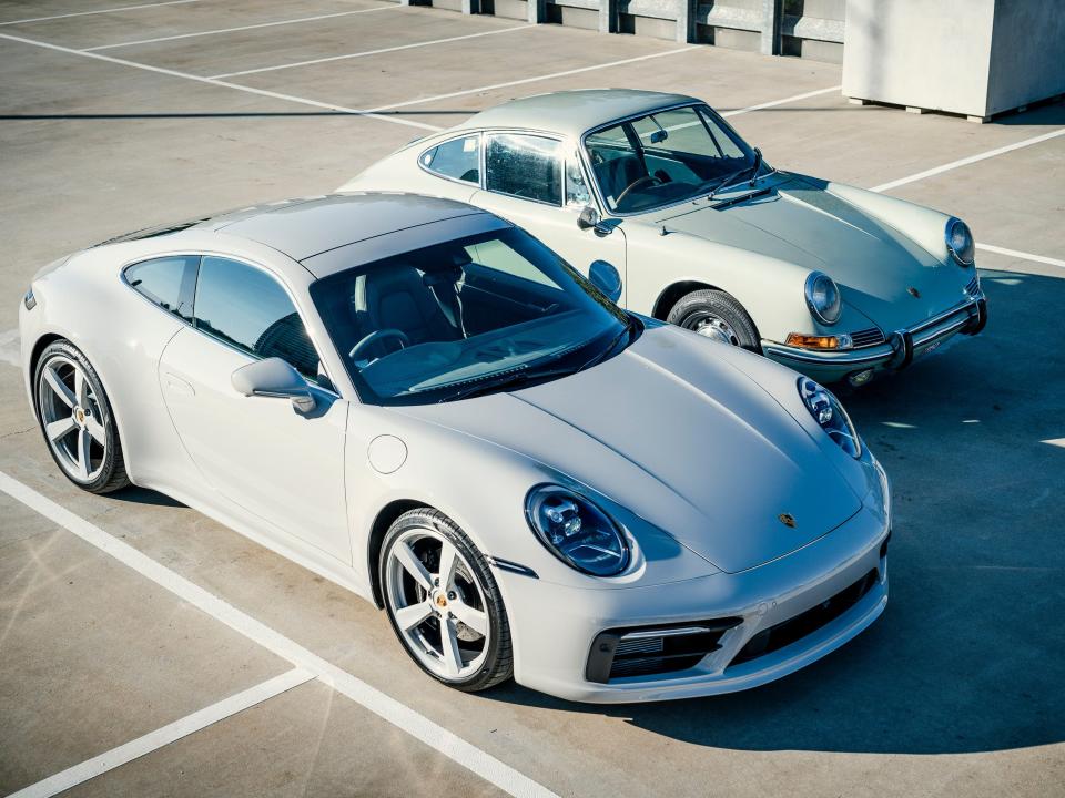A modern Porsche 911 Carrera S and a 1965 Porsche 911 in Australia in 2020.