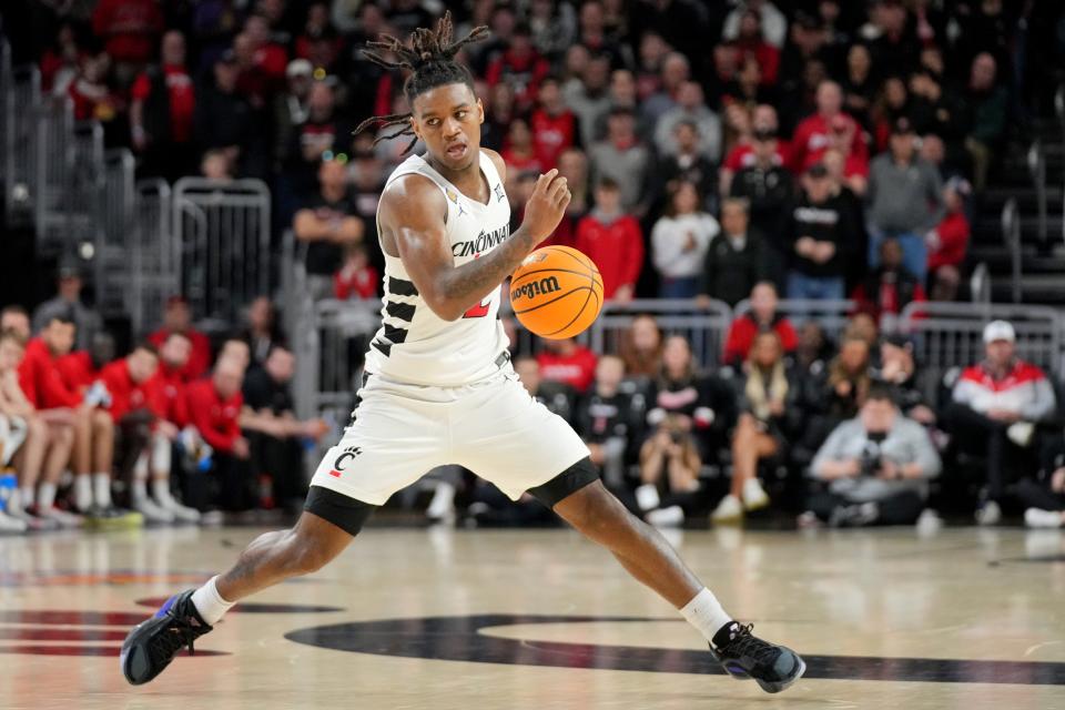 Cincinnati Bearcats guard Jizzle James (2) changes direction in the second half of a college basketball game against the Bradley Braves during a second-round game of the National Invitation Tournament,, Saturday, March 23, 2024, at Fifth Third Arena in Cincinnati.