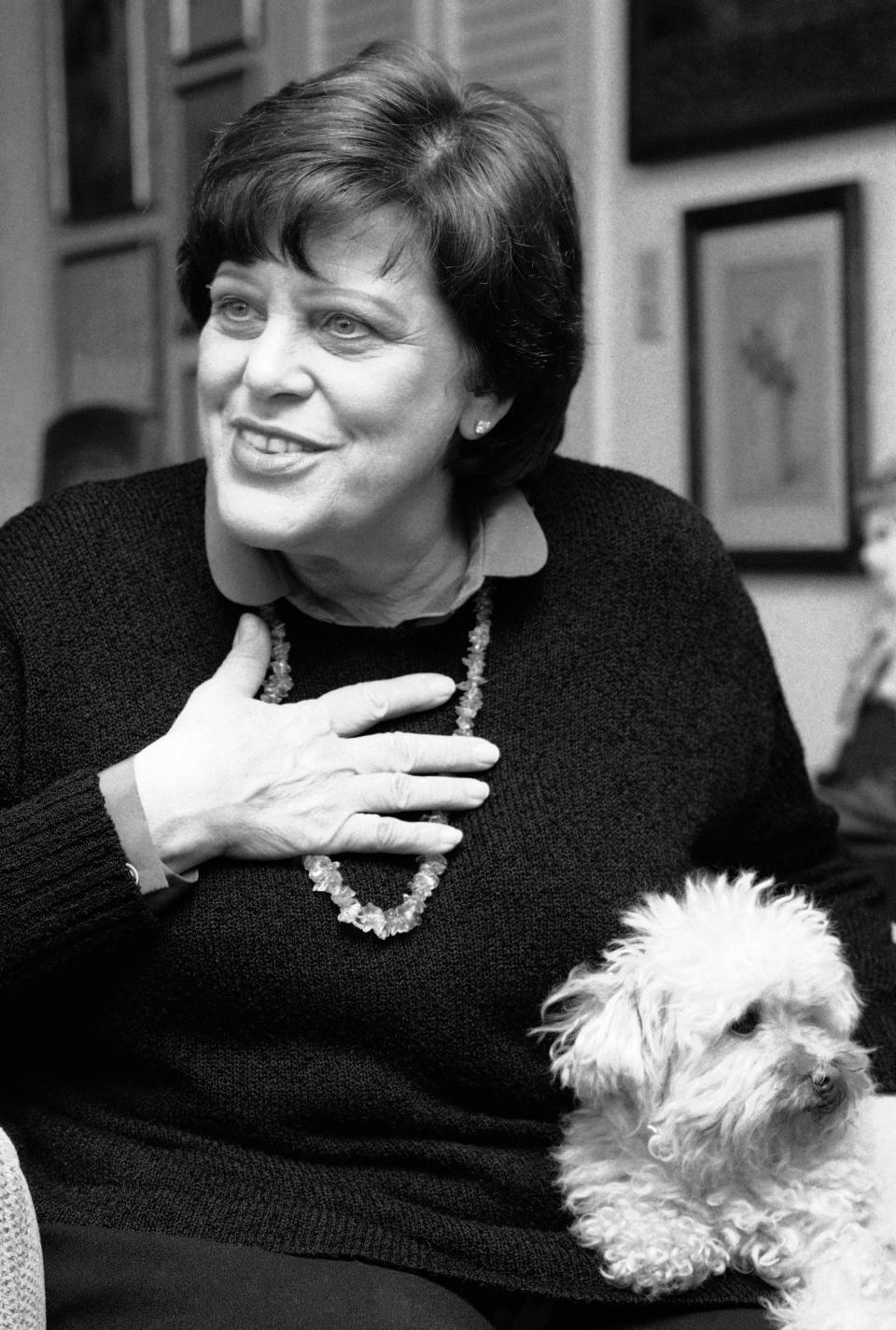 FILE - In this Feb. 27, 1984 file photo, actress Kaye Ballard appears with her dog, Big Shirley during an interview in her New York apartment. Marguerite Gordon, a friend of Ballard says the actress of the TV series “The Mothers-in-Law,” died Monday, Jan. 21, 2019, at her home in Rancho Mirage, Calif. she was 93. A boisterous comedian and singer as well as an actress, Ballard appeared in Broadway musicals and nightclubs from New York to Las Vegas. (AP Photo/Suzanne Vlamis, File)