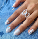 <p><a href="https://www.goodhousekeeping.com/beauty/nails/g2689/white-nail-art-designs/" rel="nofollow noopener" target="_blank" data-ylk="slk:White nails;elm:context_link;itc:0;sec:content-canvas" class="link ">White nails</a> are a summer staple. Amp them up by adding microscopic dots in shades of red and blue. For even more patriotism, place small silver stars on each nail. </p><p><a class="link " href="https://www.amazon.com/Stickers-Independence-Adhesive-Holographic-Confetti/dp/B08Z81WDY6/?tag=syn-yahoo-20&ascsubtag=%5Bartid%7C10055.g.1278%5Bsrc%7Cyahoo-us" rel="nofollow noopener" target="_blank" data-ylk="slk:SHOP STAR DECALS;elm:context_link;itc:0;sec:content-canvas">SHOP STAR DECALS</a></p>