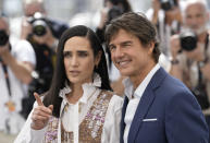 Jennifer Connelly, left, and Tom Cruise pose for photographers at the photo call for the film 'Top Gun: Maverick' at the 75th international film festival, Cannes, southern France, Wednesday, May 18, 2022. (Photo by Joel C Ryan/Invision/AP)