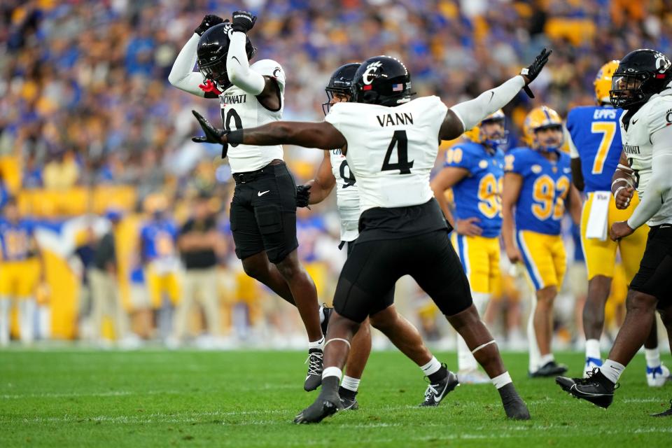 Malik Vann (4) celebrates a missed field goal in UC's win at Pitt last season.