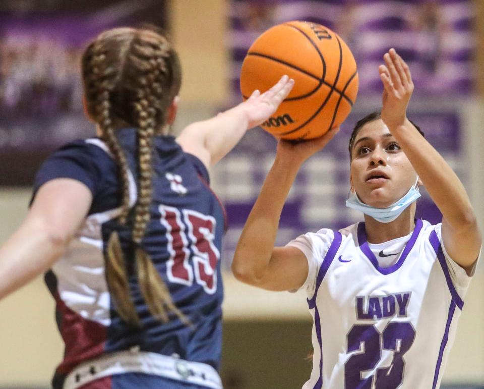 Shadow Hills' Sonia Urbina (23) takes a shot while guarded by Trinity Classical Academy's Ella Stepan (15) during the second quarter of their CIF-SS semifinal game at Shadow Hills High School in Indio, Calif., Wednesday, Feb. 23, 2022.