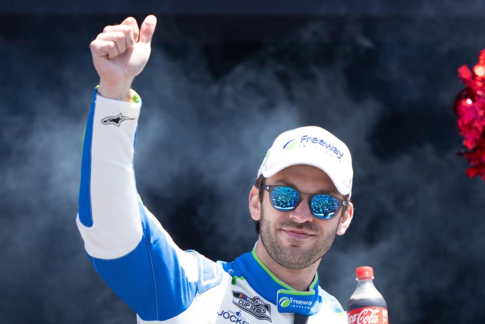 Daniel Suarez acknowledges the crowd during driver introductions last week at Sonoma Raceway.