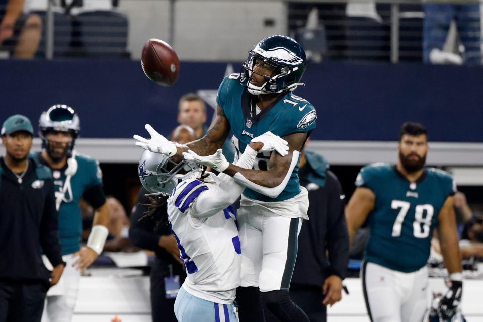 Dallas Cowboys cornerback Maurice Canady, left, defends as Philadelphia Eagles wide receiver Quez Watkins (16) reaches out to make a catch in the second half of an NFL football game in Arlington, Texas, Monday, Sept. 27, 2021. (AP Photo/Ron Jenkins)