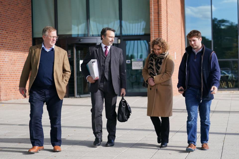 Hannah Ingram-Moore attended an appeal hearing against the demolition of a spa pool block at her home, with husband Colin (far left) and son Benji (right) (PA Wire)