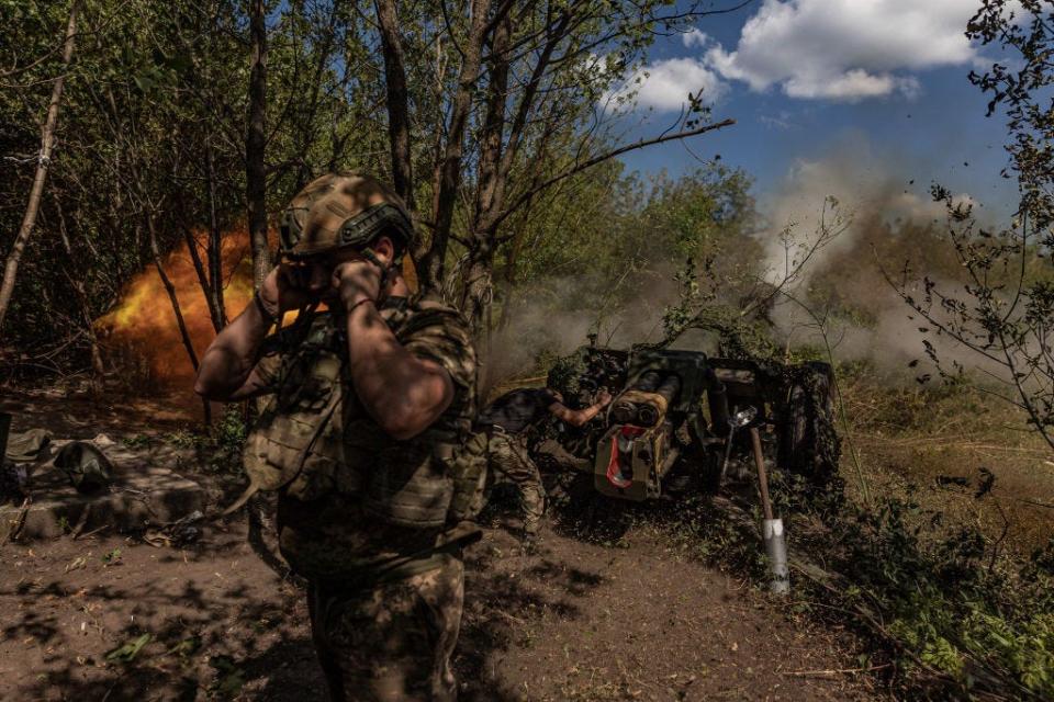 Ukrainian soldiers fire with D-30 artillery at Russian positions in the direction of Klishchiivka, in Donetsk Oblast, Ukraine, on August 13, 2023.