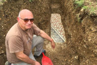 Gianni De Zuccato a well-preserved colorful mosaic floor of an ancient Roman villa archaeologists have revealed among vineyards near the northern city of Verona, Italy. The official in charge of archaeology Verona province, Gianni De Zuccato, on Friday, May 29,2020, said the mosaics appeared to be ‘’in a good state of conservation,’’ from what they are able to observe after gingerly digging a trench between vineyards in the hills of Valpolicella, known for its full-bodied red wine. (Soprintendenza ABAP Verona via AP)