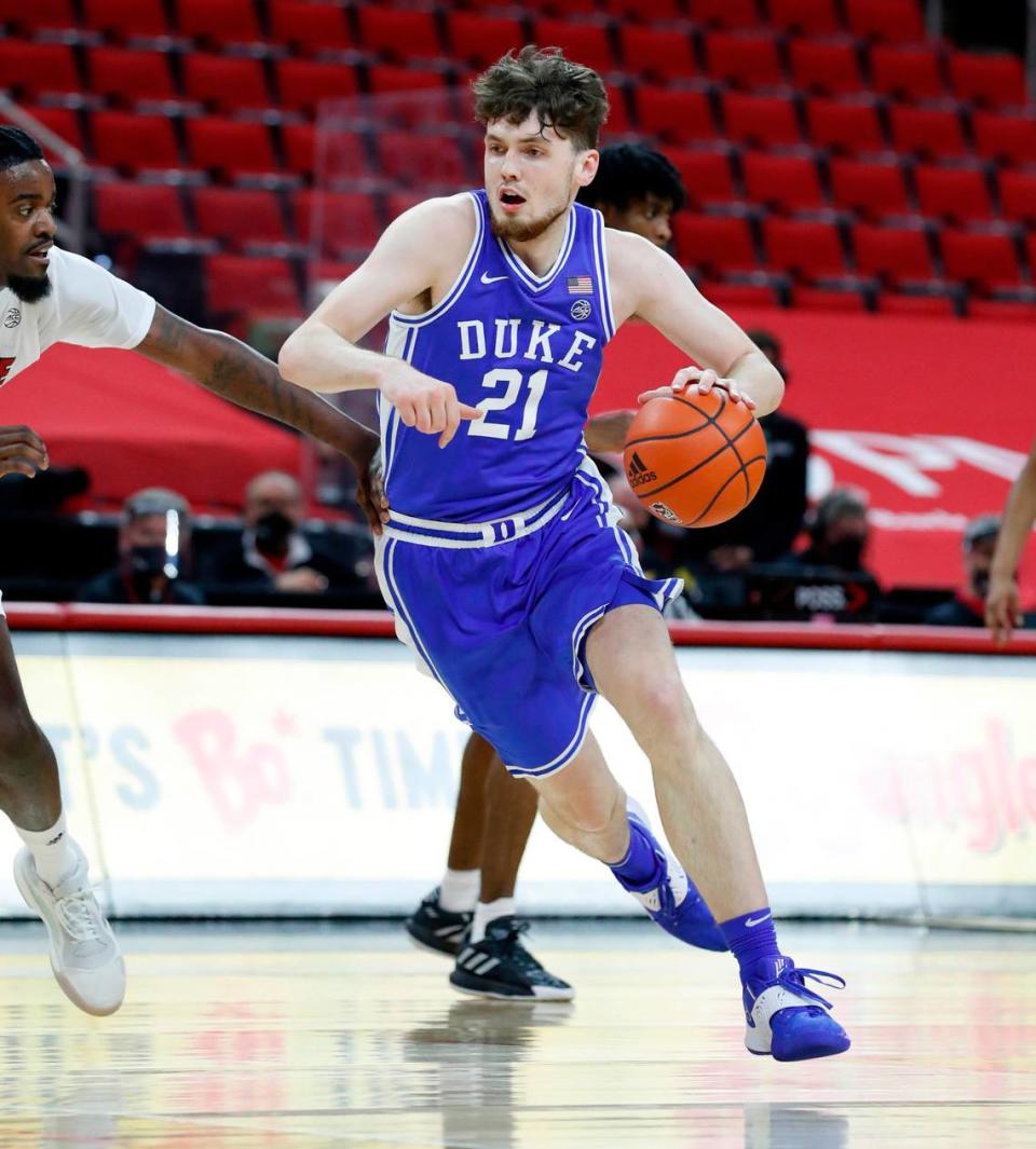 Duke’s Matthew Hurt (21) drives around N.C. State’s D.J. Funderburk (0) during the second half of Duke’s 69-53 victory over N.C. State at PNC Arena in Raleigh, N.C., Saturday, February 13, 2021.
