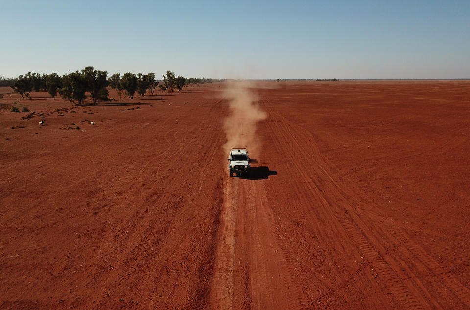 Grazier Scott Todd drives through his drought affected property during a stock feed run near Bollon in southwest Queensland. Source: AAP