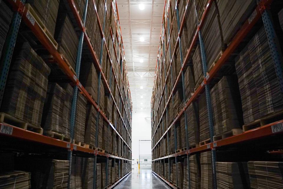 Boxes are stackedon shelves at the Uline warehouse in Naples on Tuesday, April 18, 2023.