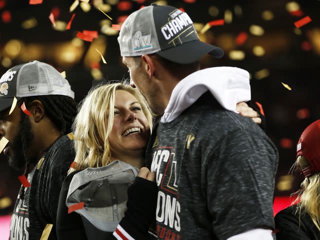 <p>Michael Zagaris/San Francisco 49ers/Getty </p> Kyle Shanahan and Mandy Shanahan during the NFC Championship trophy ceremony following game against the Green Bay Packers at Levi's Stadium on January 19, 2020.