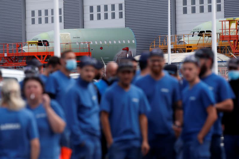 Airbus employees gather outside the Airbus facility in Montoir-de-Bretagne near Saint-Nazaire