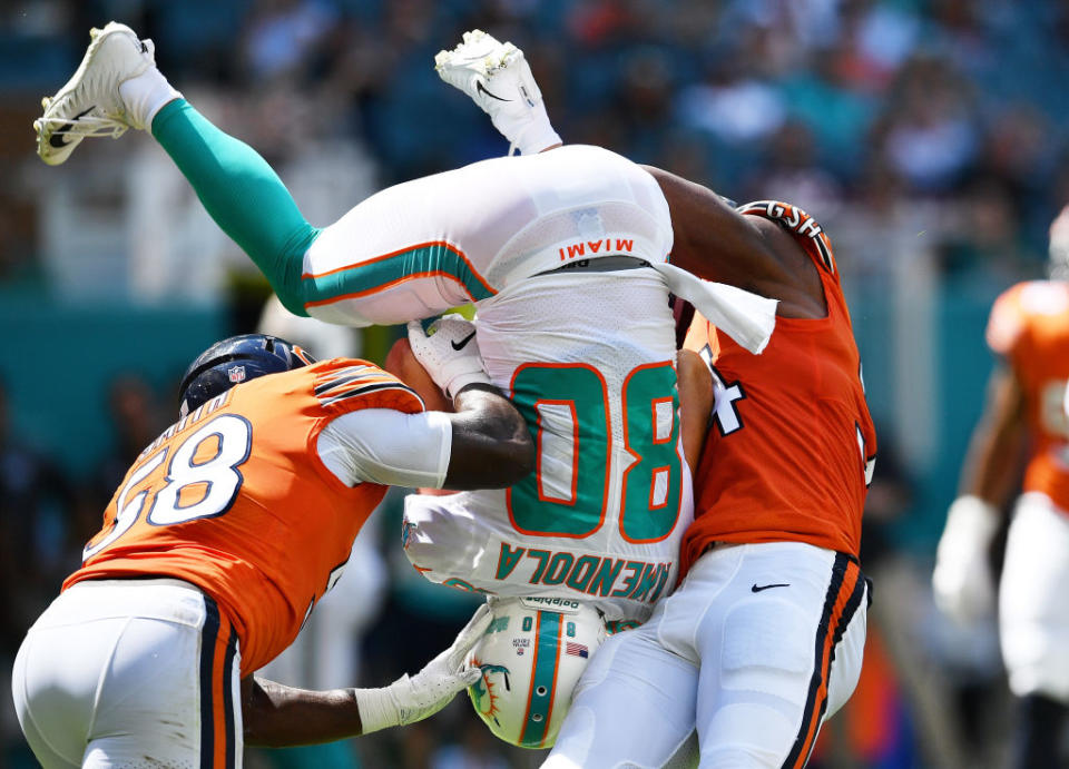 Miami receiver Danny Amendola is turned upside down when he was body slammed by Chicago’s Leonard Floyd. (Getty Images)