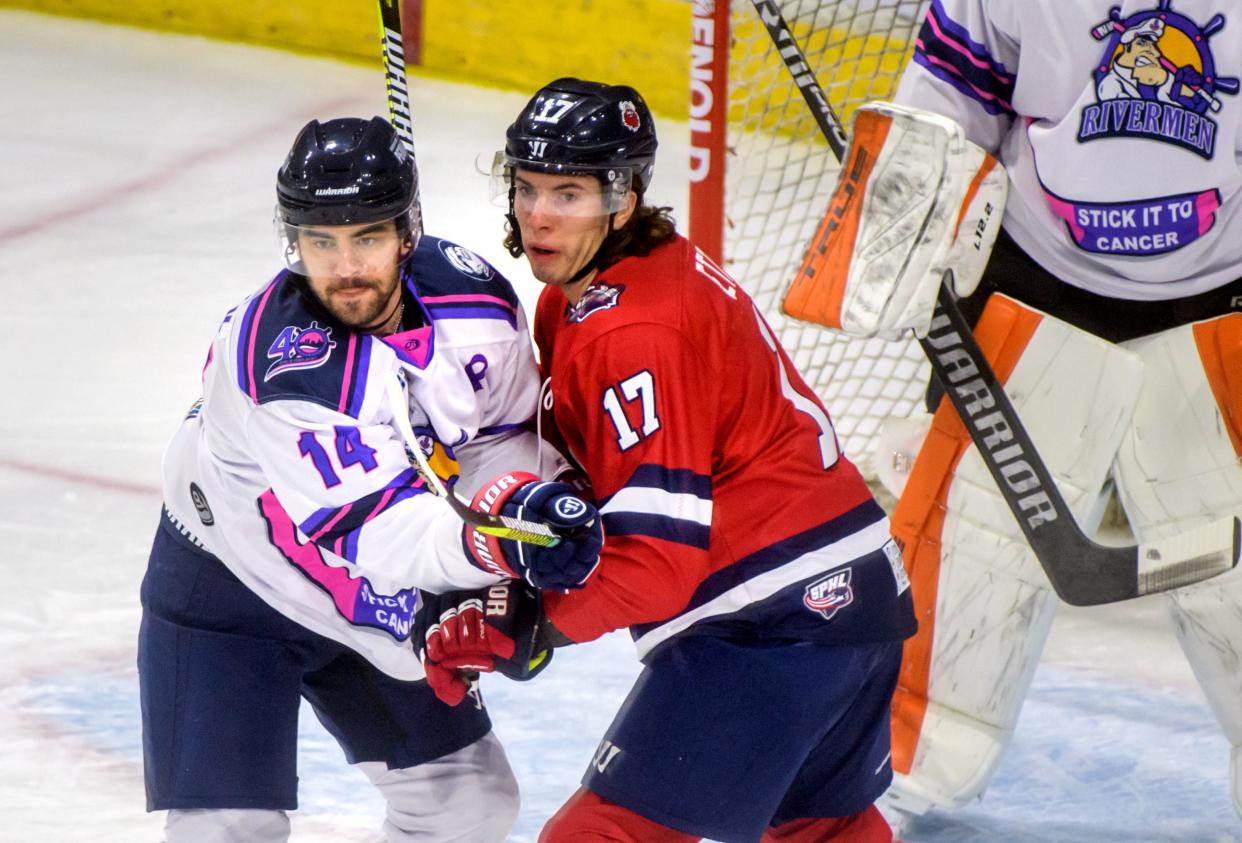 Peoria's Skyler Smutek (14) and Macon's Bryan Etter tangle in front of the net during a game on Oct. 23, 2021 at Carver Arena. The Rivermen traded the defenseman to Vermillion on Thursday, Nov. 11, 2021.