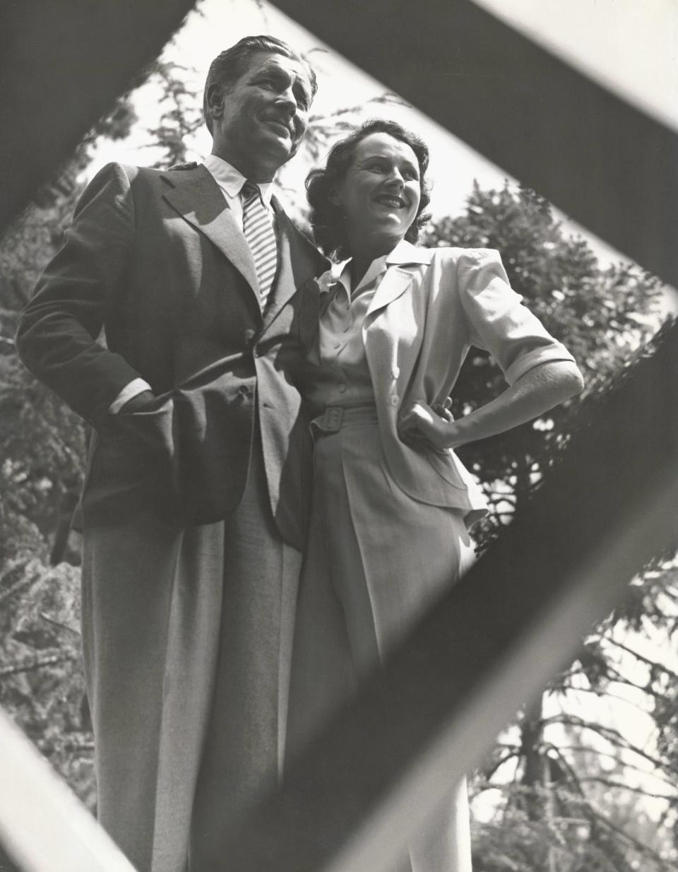Hume (with second husband Ronald Coleman) wears a pantsuit with a short sleeved jacket, standing in the garden of their Brentwood, California home in 1940.