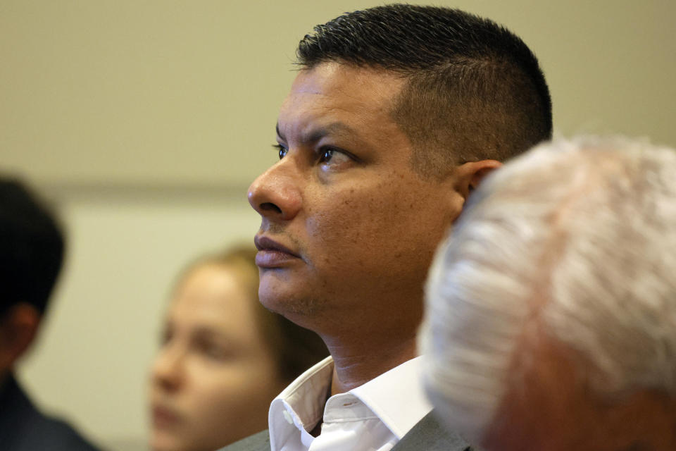 Royer Borges attends a hearing at the Broward County Courthouse in Fort Lauderdale, Fla., Monday, Dec. 18, 2023. Borges' son, Anthony, was shot several times and critically wounded in the 2018 massacre at Marjory Stoneman Douglas High School. (Amy Beth Bennett/South Florida Sun-Sentinel via AP, Pool)